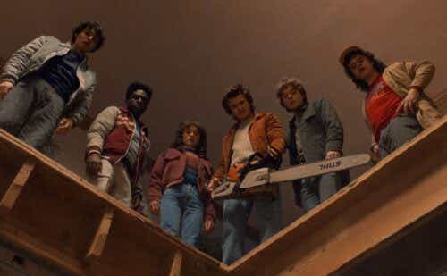 Stranger Things characters holding a chainsaw and looking down.