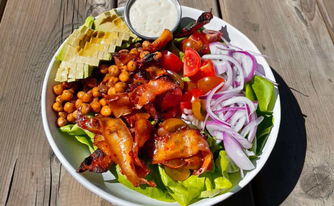 A bowl of tofu bacon cobb salad.
