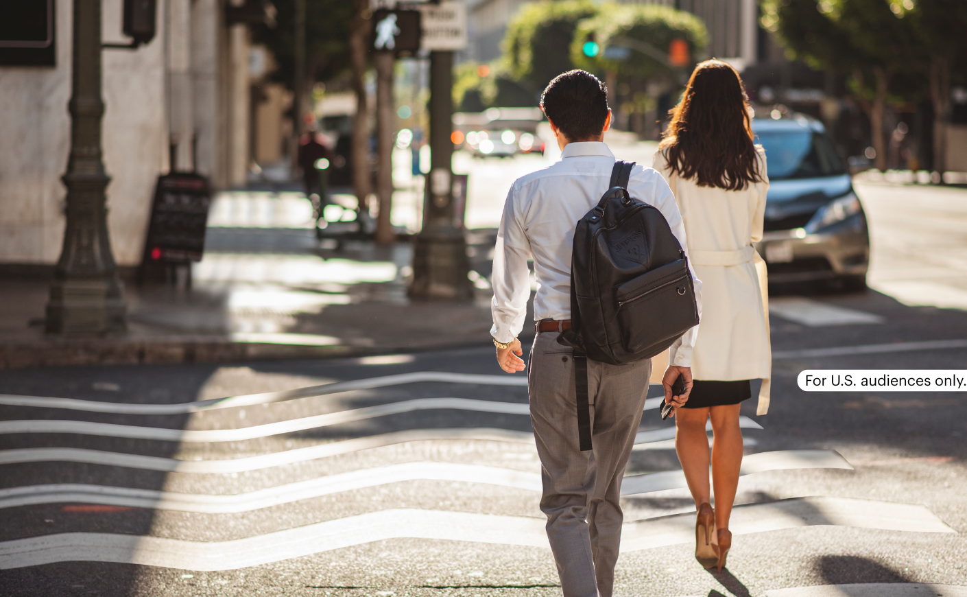 man and woman walking on crosswalk with warped lines