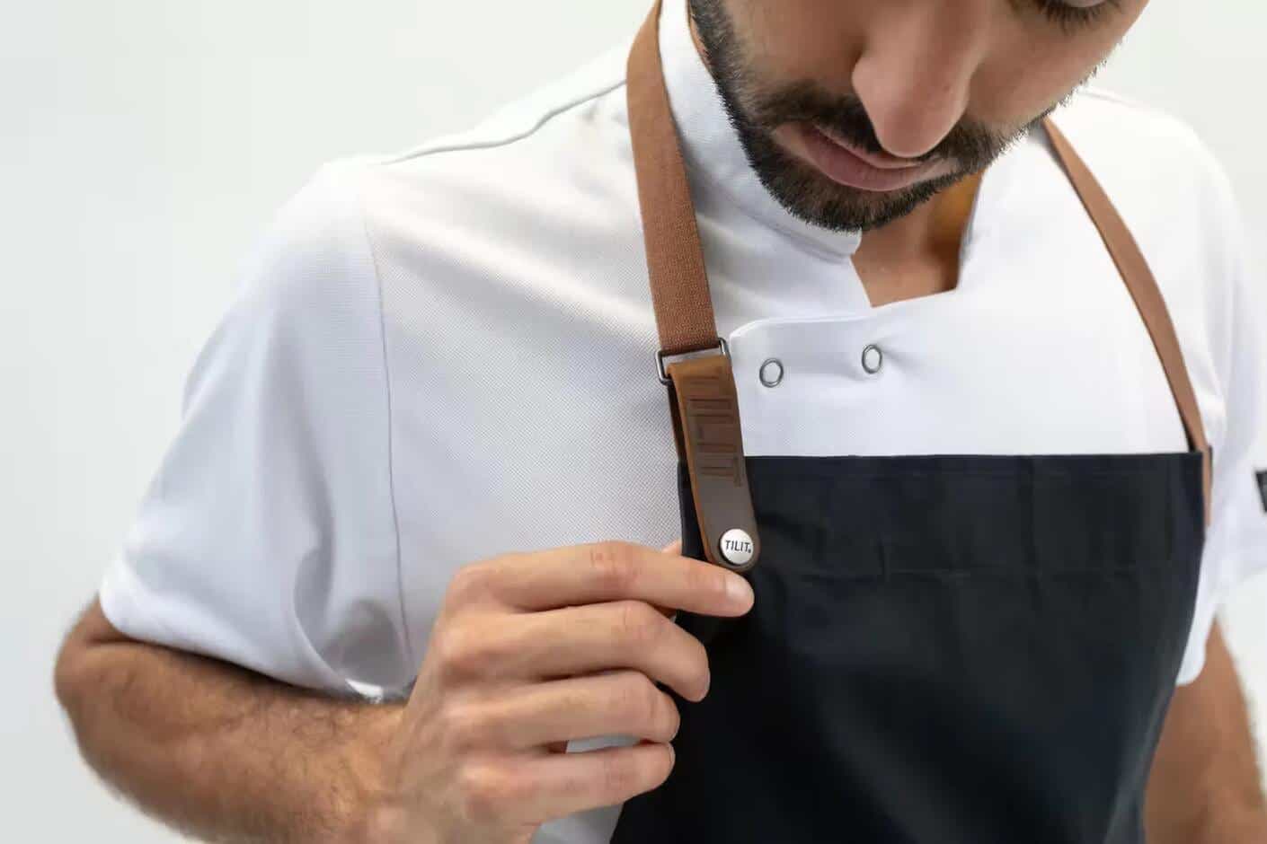 A man wearing a Tilit apron