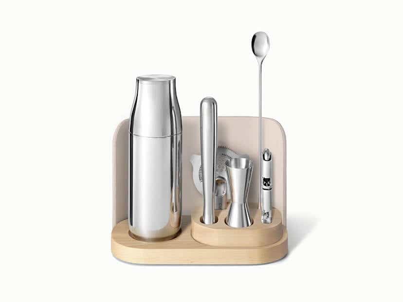 A set of steel bar tools in a wooden base.