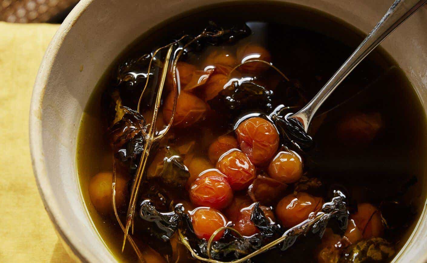 A bowl of confit tomatoes in oil.