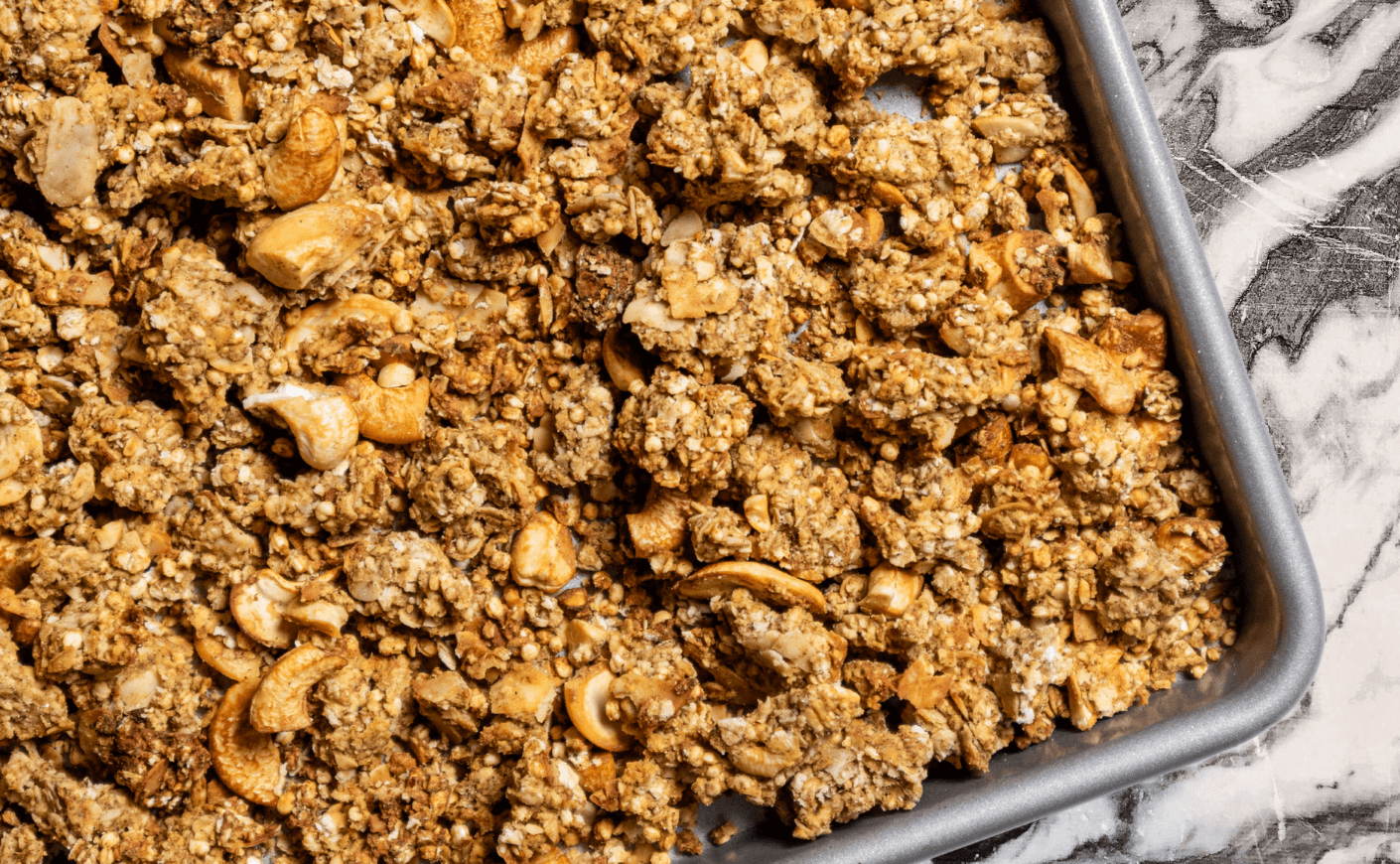 granola on a baking sheet
