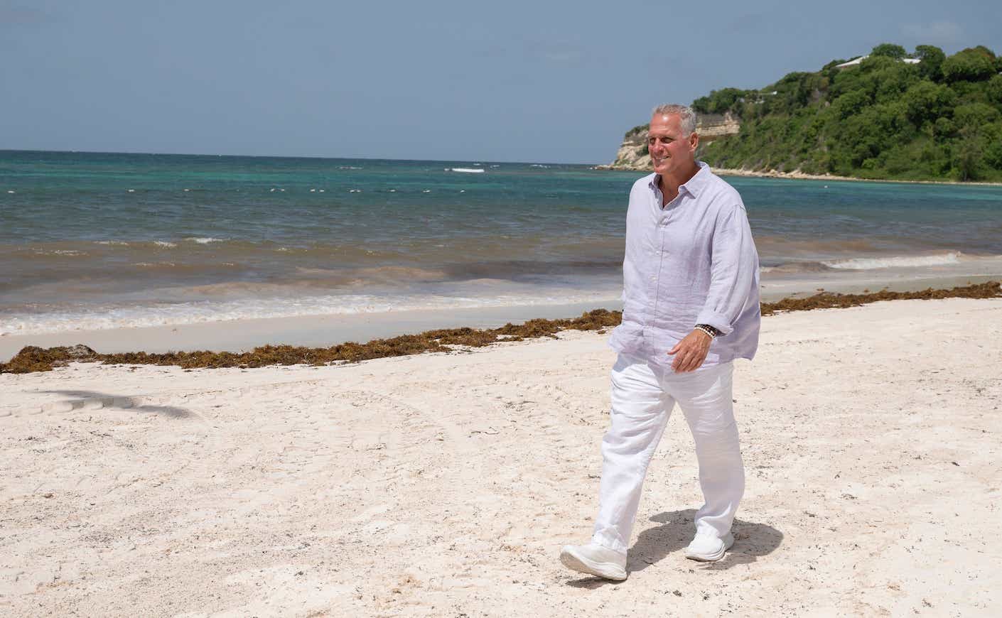 mel owens walking on a beach