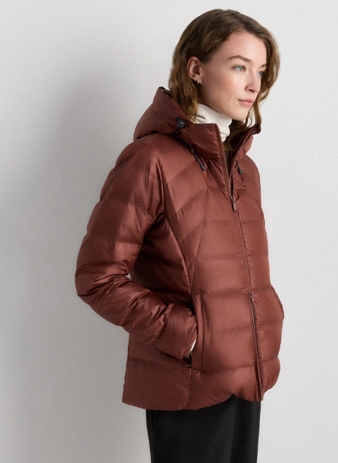 woman wearing a copper colored lightweight puffer