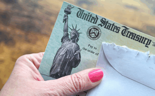 close-up of hand holding stimulus check