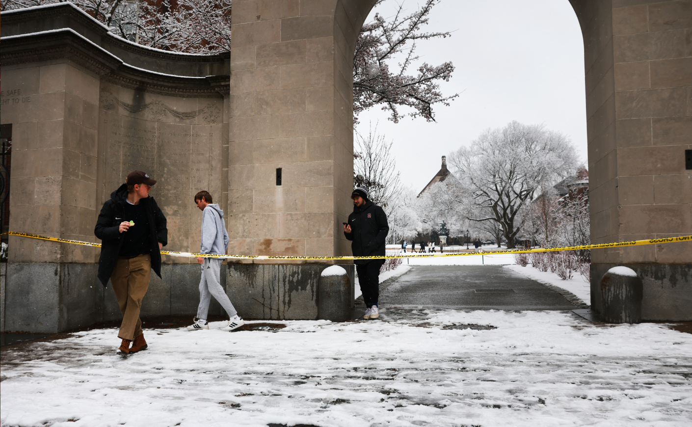 caution tape blocking off part of the campus at Brown University after the mass shooting