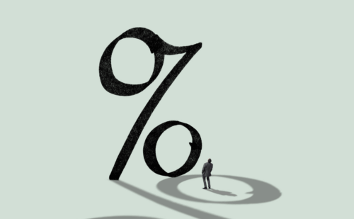 Person looking at giant percentage sign