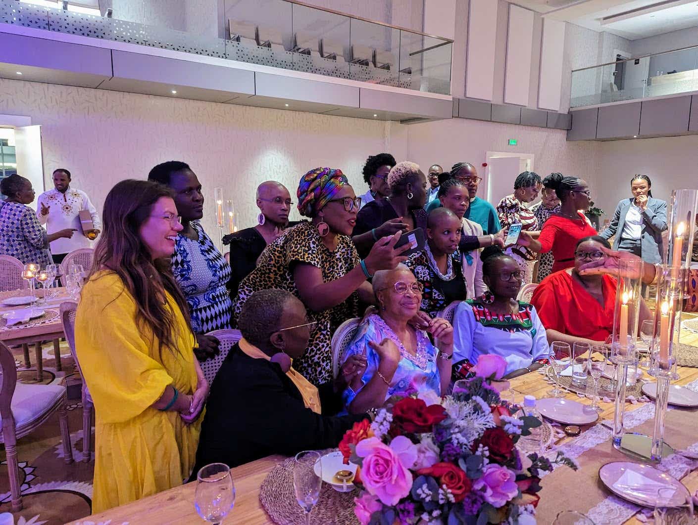 a group of women posing for a photo