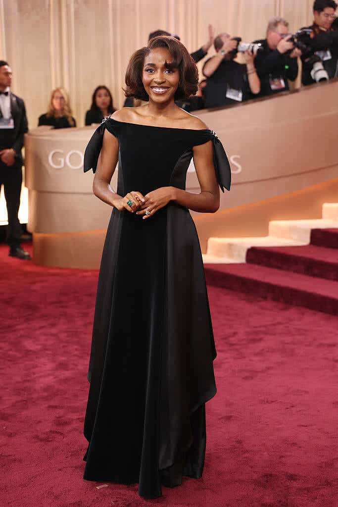 Ayo Edebiri wears an off-the-shoulder black gown