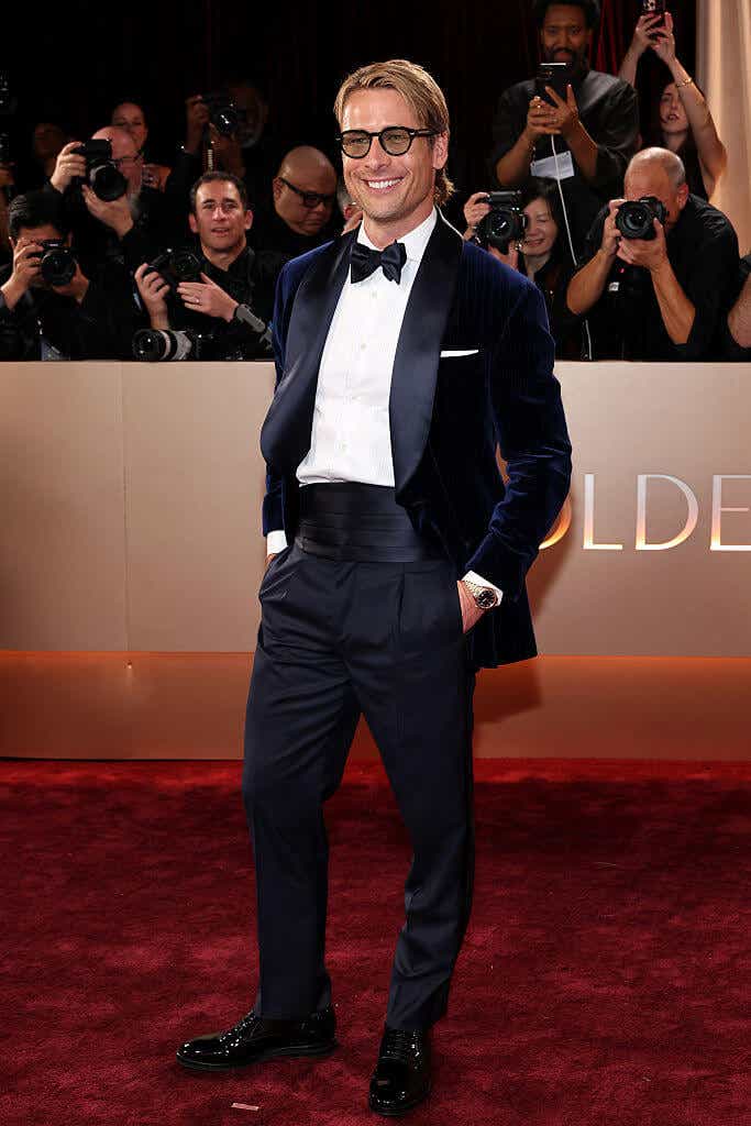 Glen Powell wears a navy blue tux to the Golden Globes