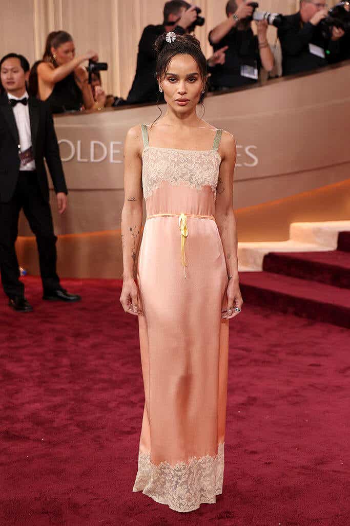 Zoë Kravitz wears a light pink slip dress to the Golden Globes