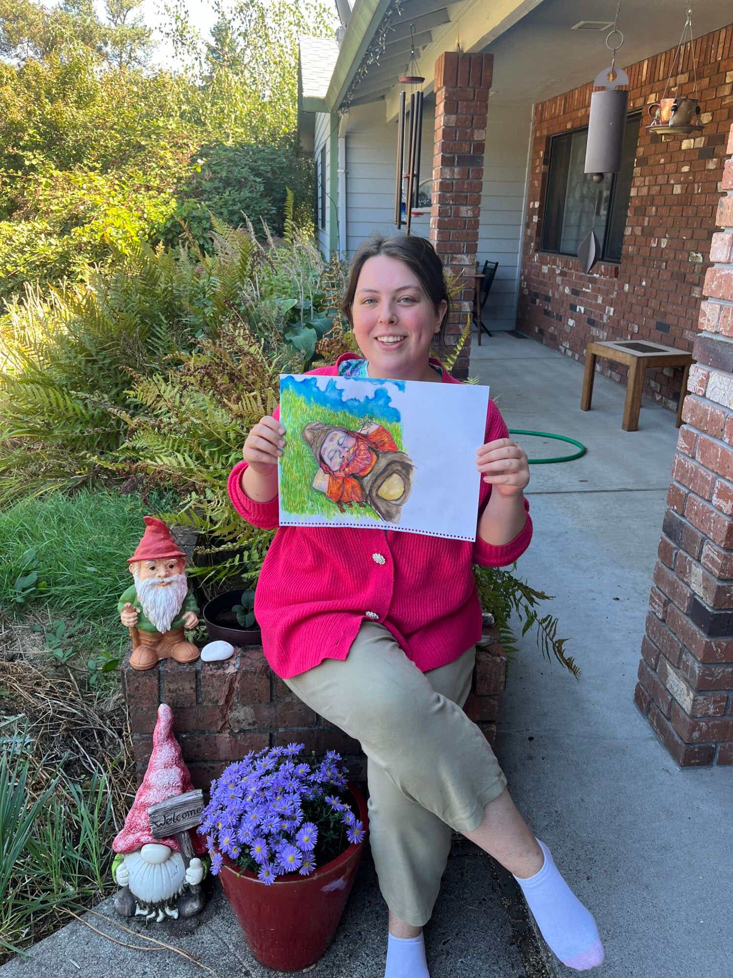 Randy Webster's daughter Janet displays a painting of a gnome for the new Tarra Tales book series