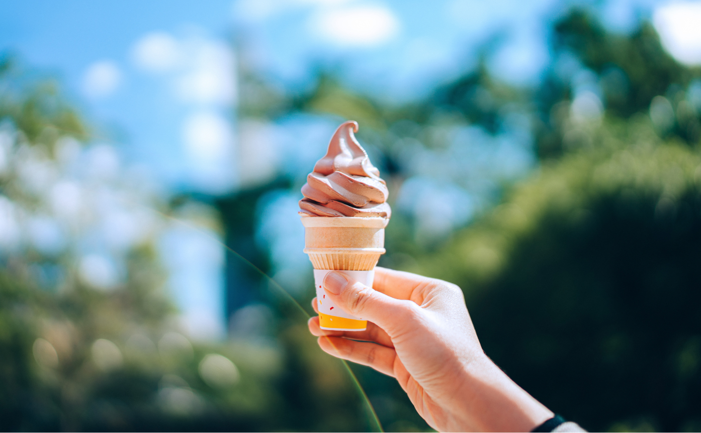 person holding ice cream cone