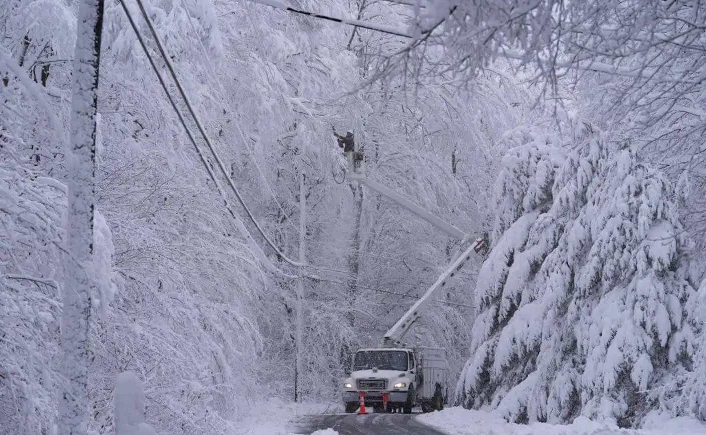 a snowy road with a truck