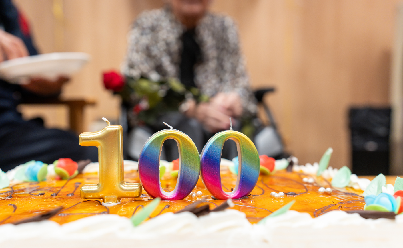 a 100 birthday candle on a cake