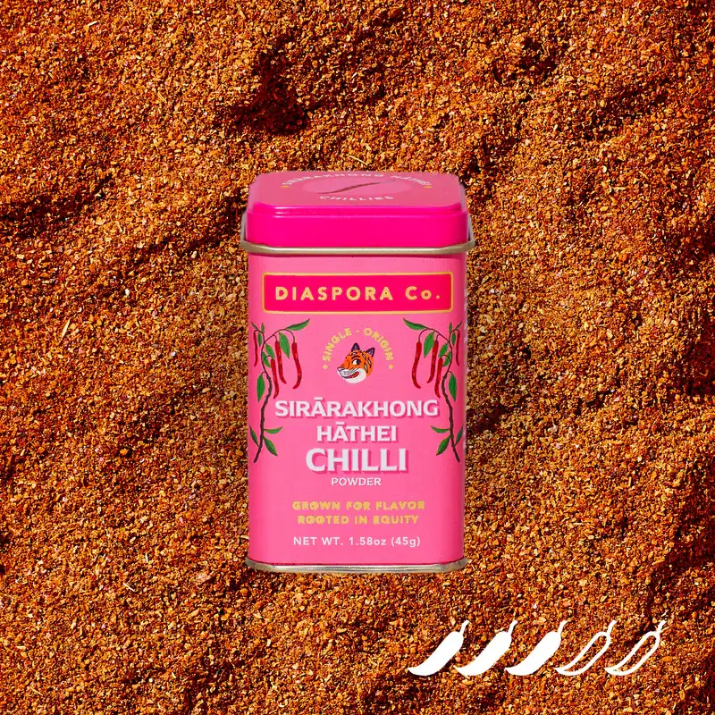 A pink container of Sirārakhong Hāthei Chilli.