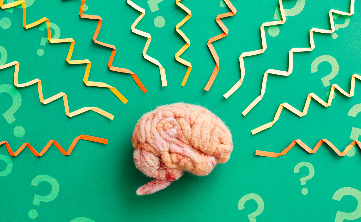 brain surrounded by question marks