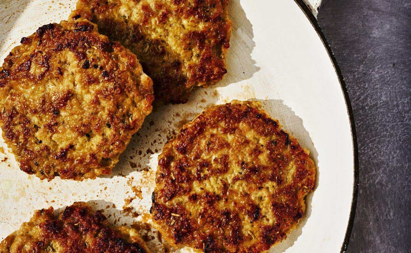 Maple-chicken breakfast patties on a plate.