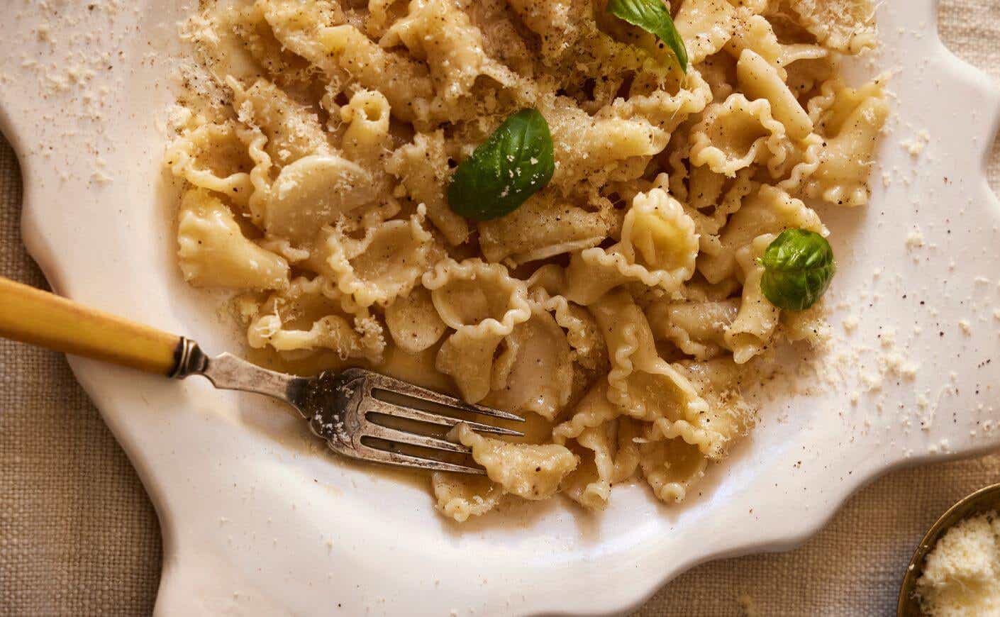 A bowl of buttered pasta.