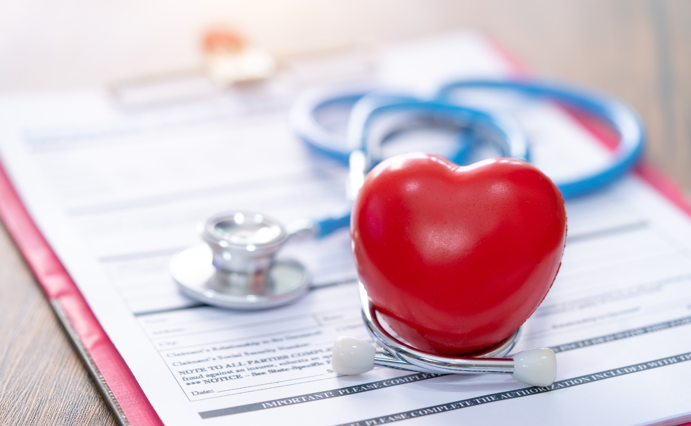 plastic heart on clipboard