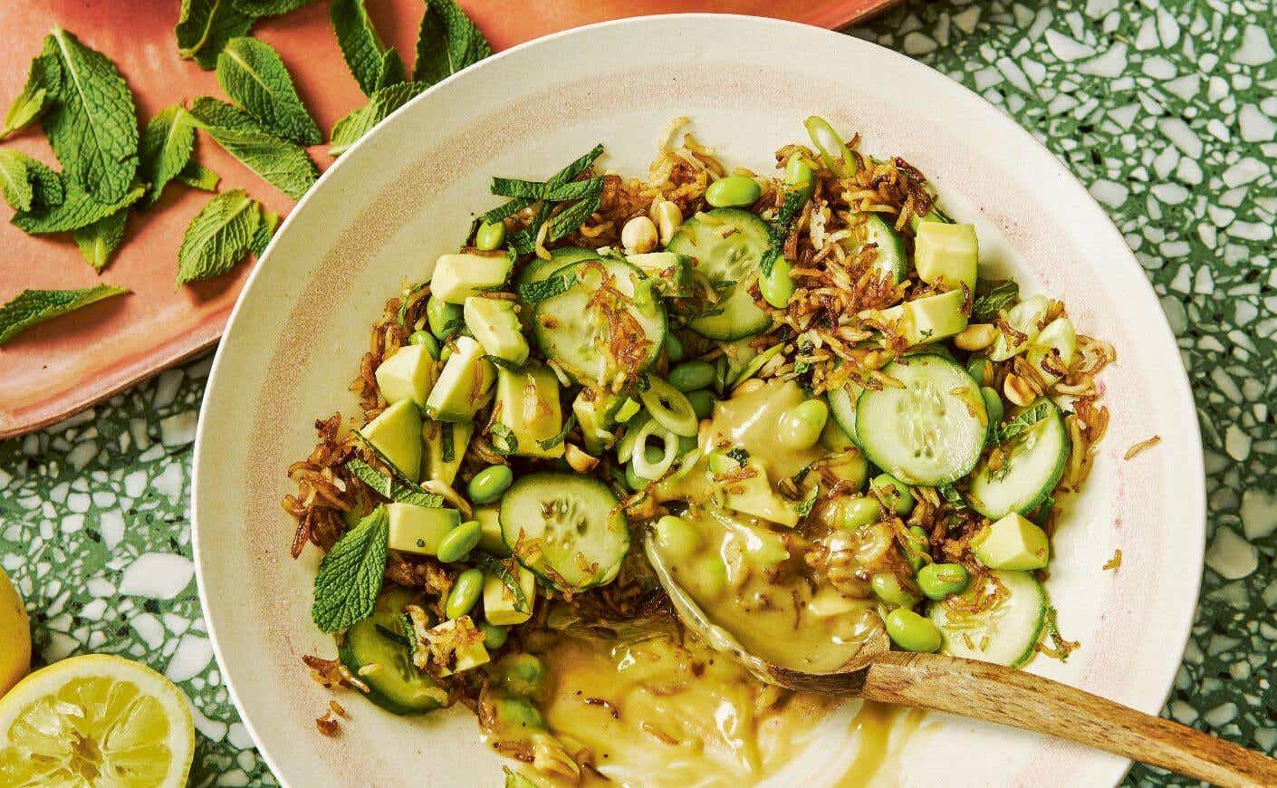 A bowl of crispy rice salad with tahini and lemon.