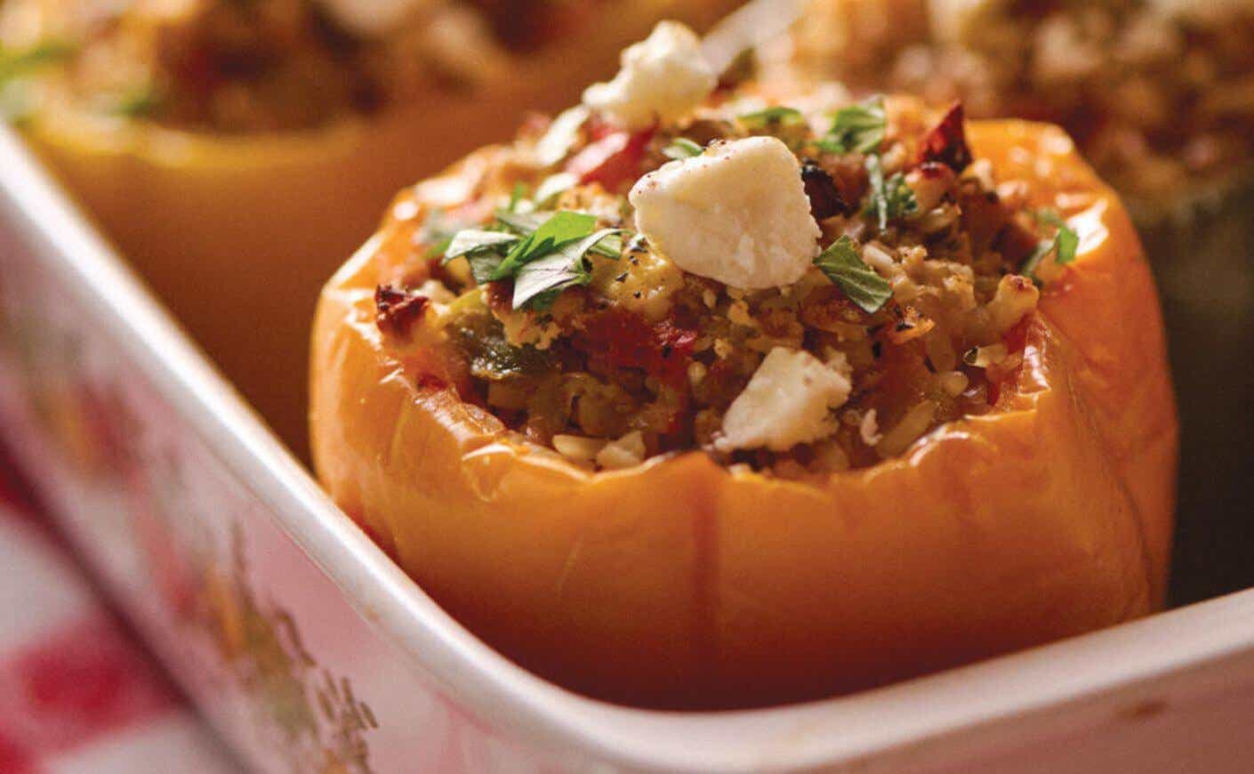 A stuffed pepper in a baking pan.