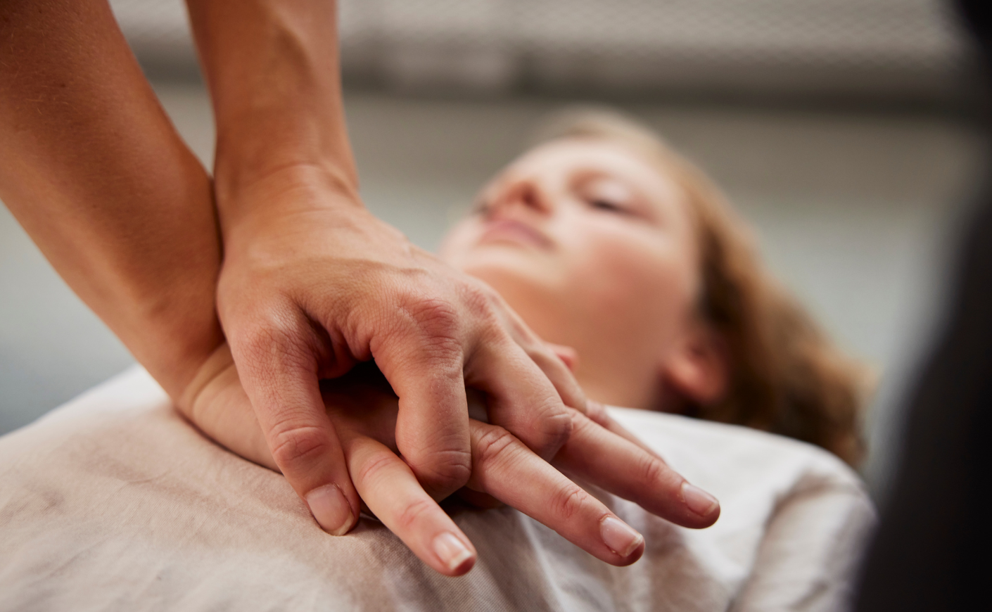 CPR being performed on a woman
