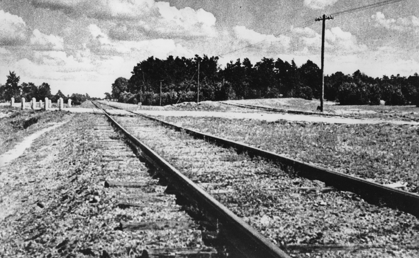 Black-and-white photo of the train tracks that led to Treblinka. 