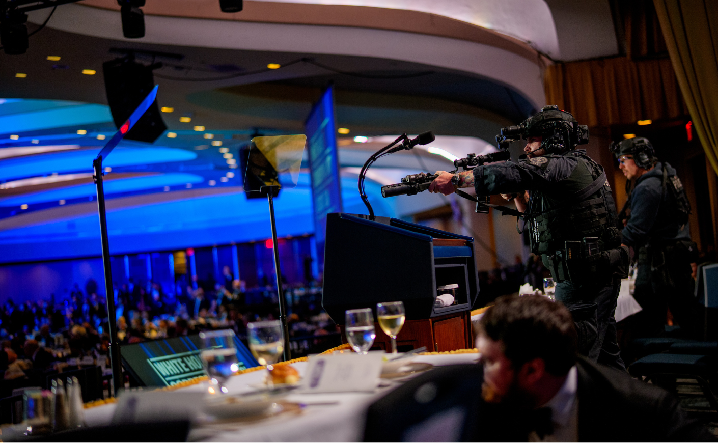 Agents with guns drawn at the Washington DC Hilton where the WHCA was being held