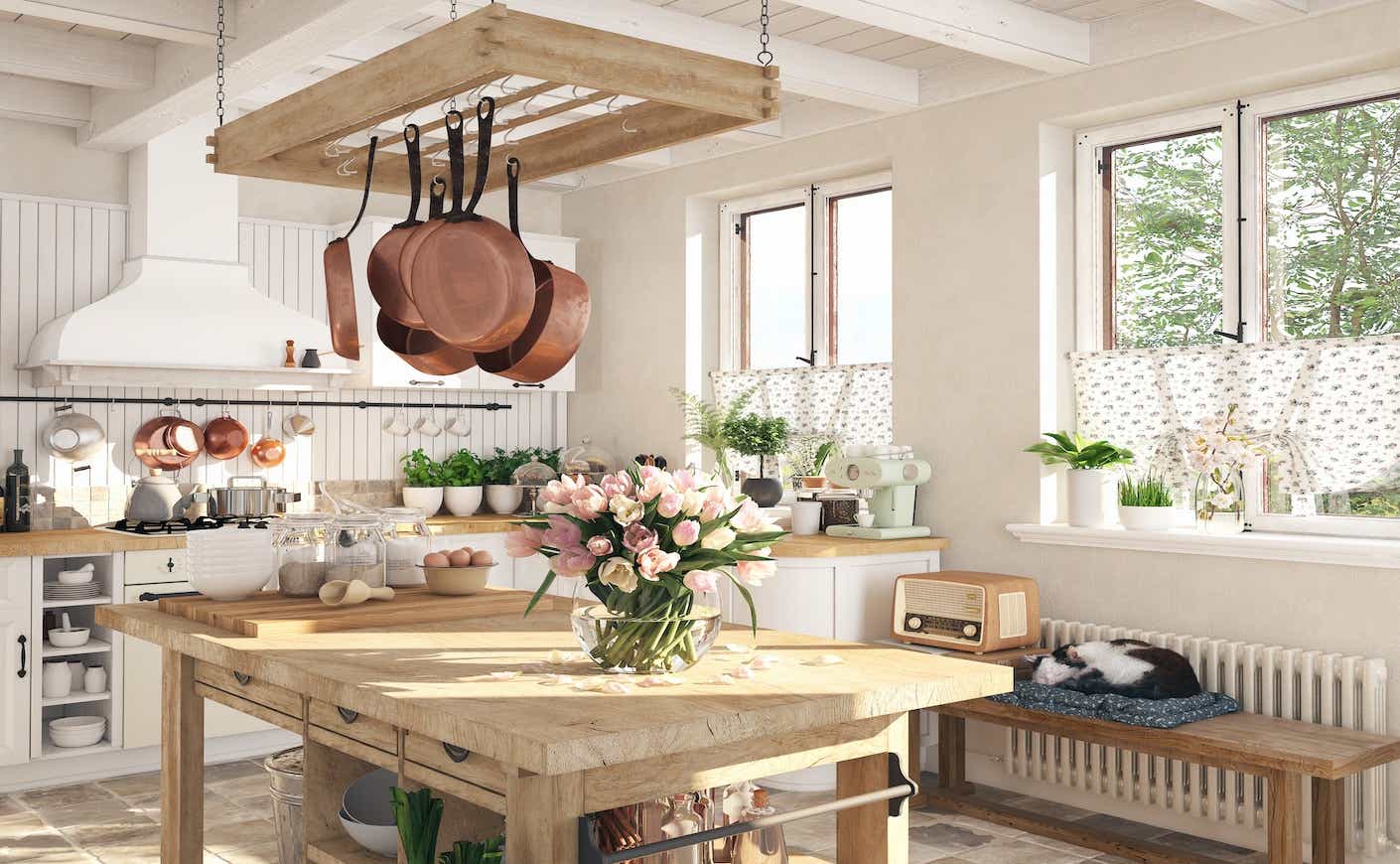 elegant styled kitchen with flowers on a wooden island