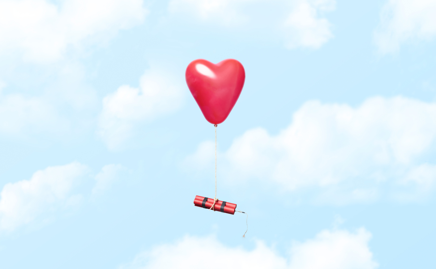 A stick of dynamite tied to a heart-shaped balloon
