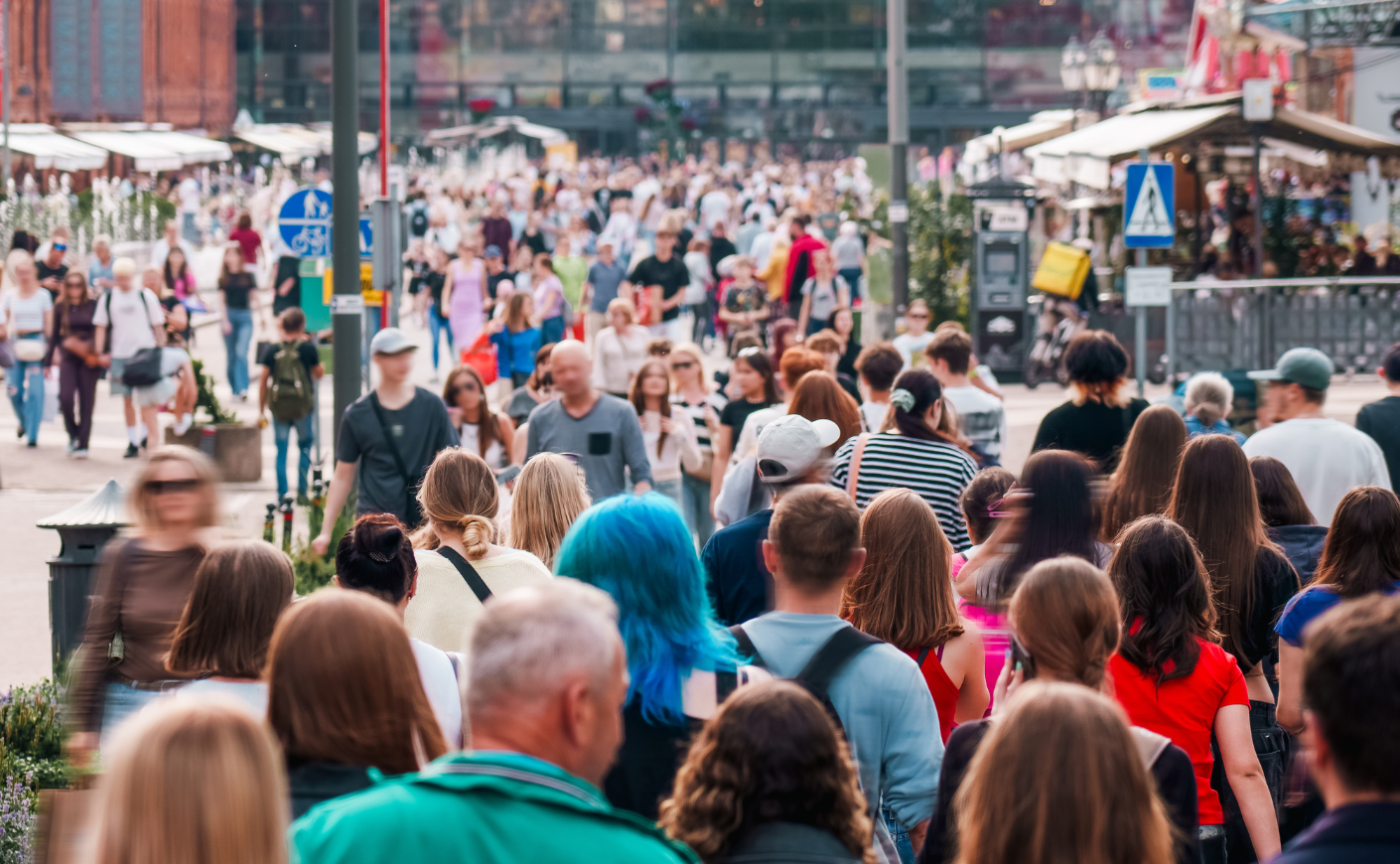 People walking outside, a crowd.