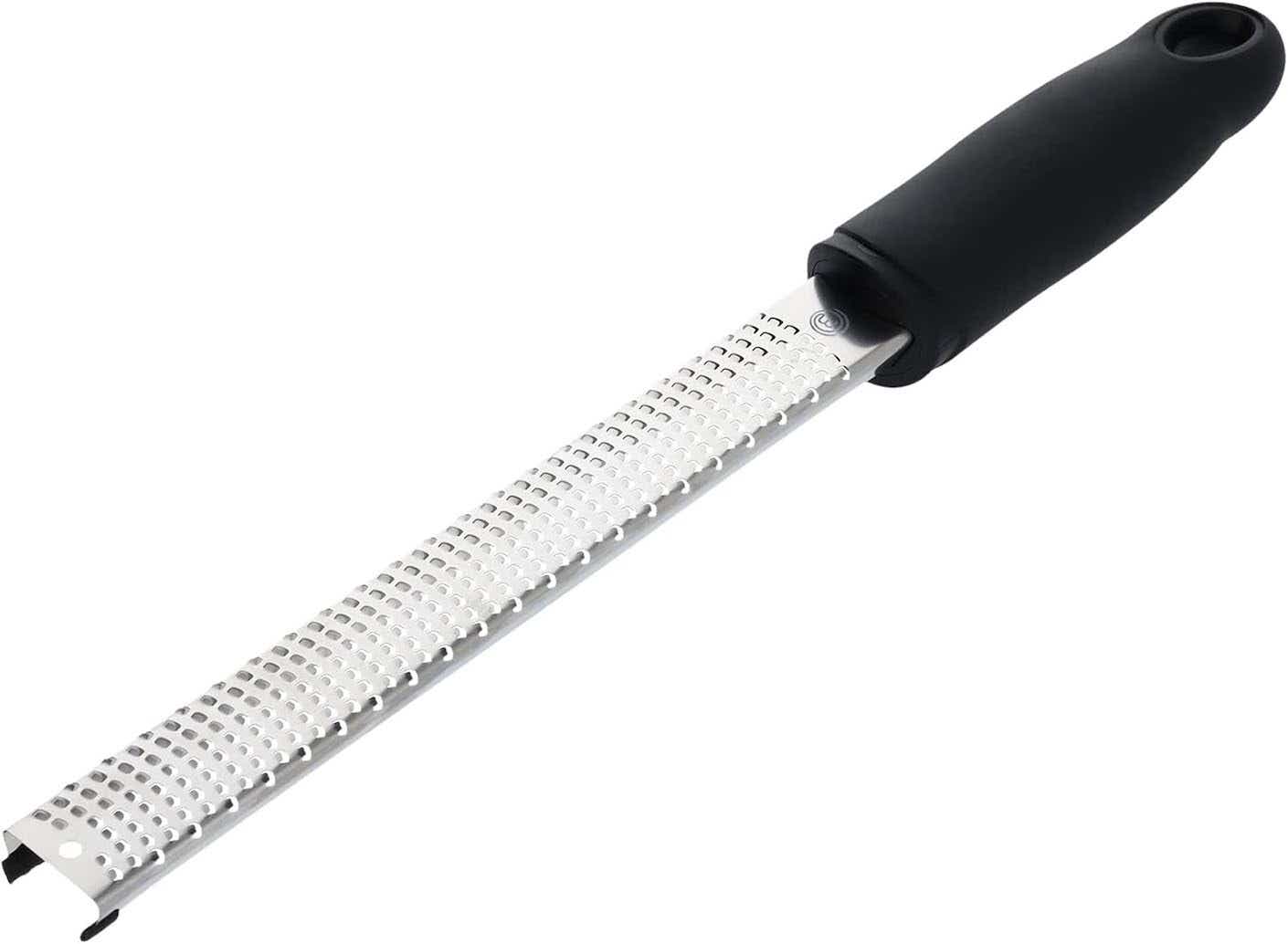 A microplane with a black handle.