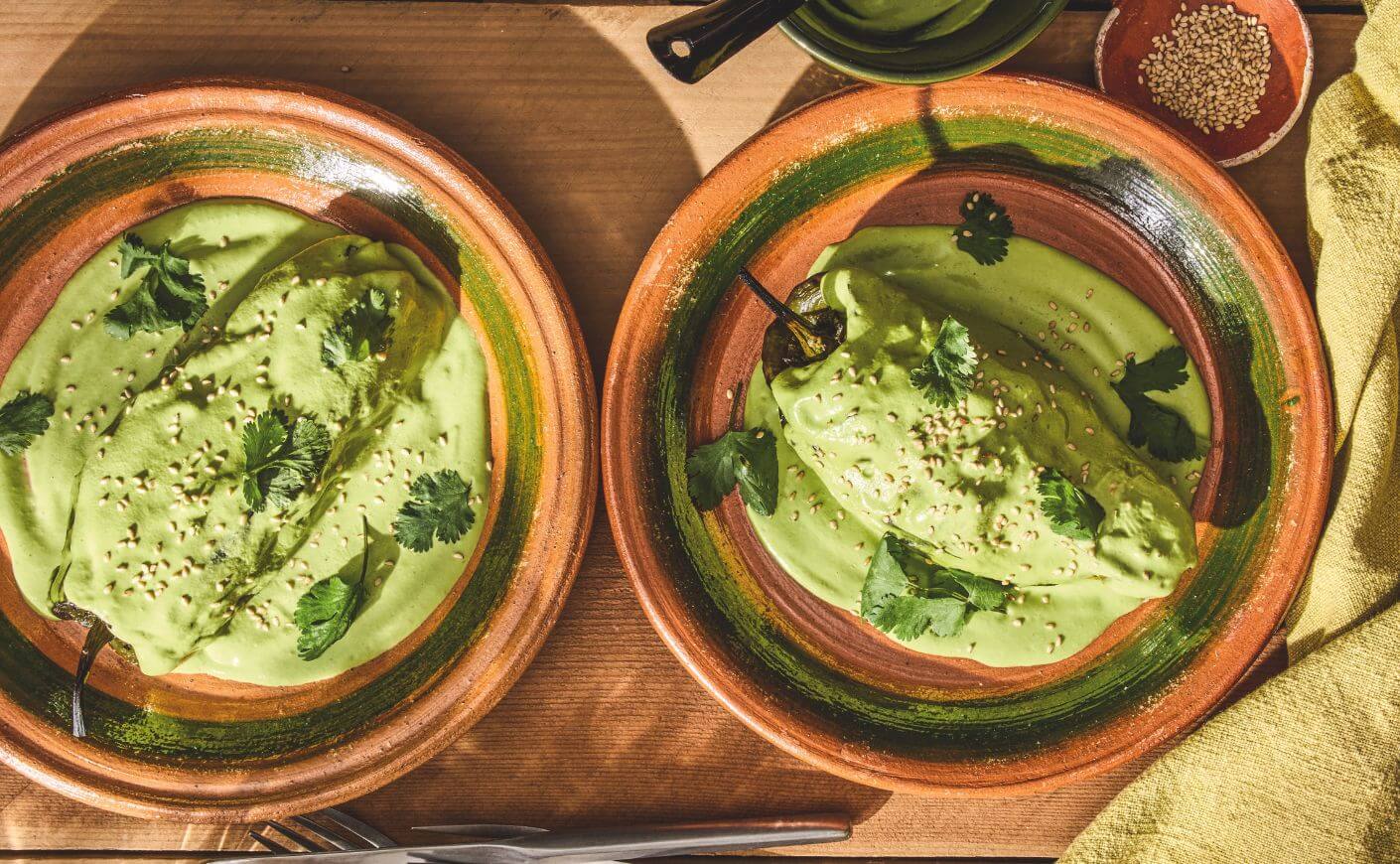 Two stuffed and roasted poblanos.