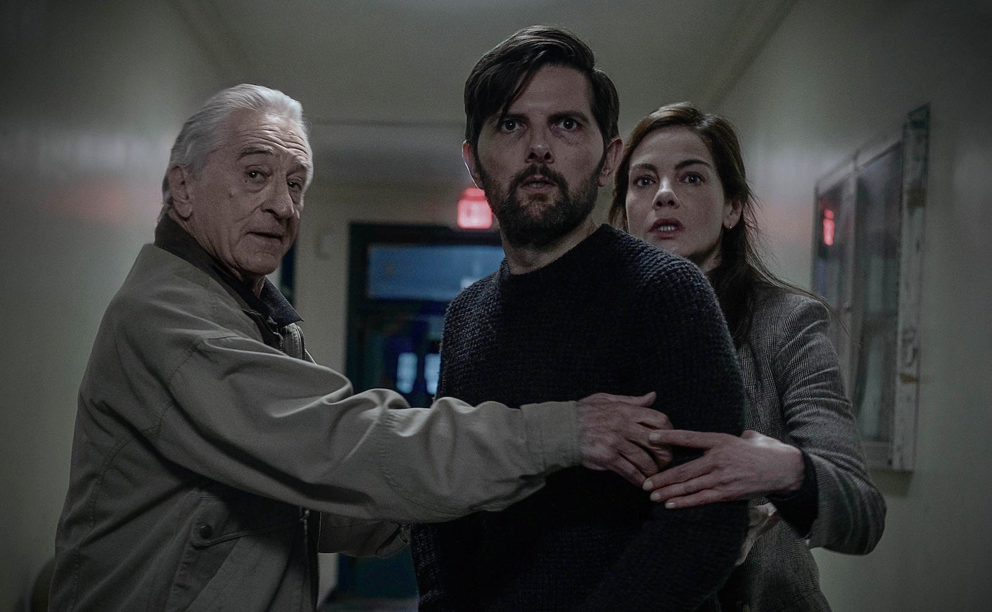robert de niro and michelle monaghan hold adam scott in a still from the whisper man