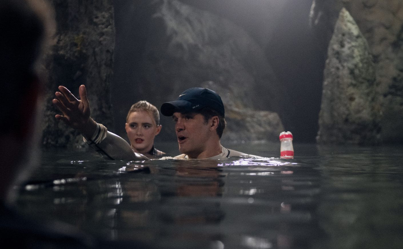Jeff Wadlow directing Kathryn Newton as they tread water inside a cave.