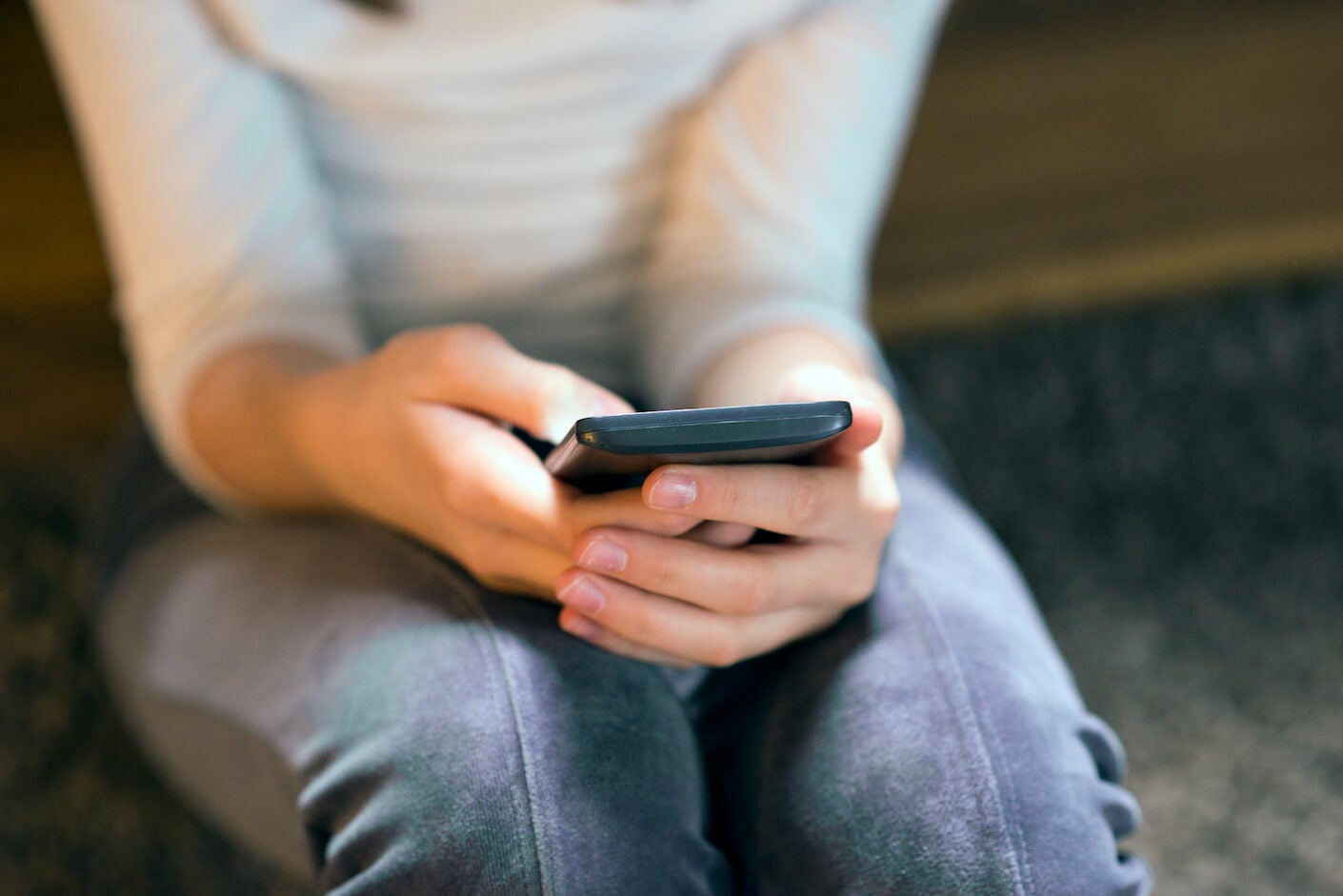 A woman using a smartphone.