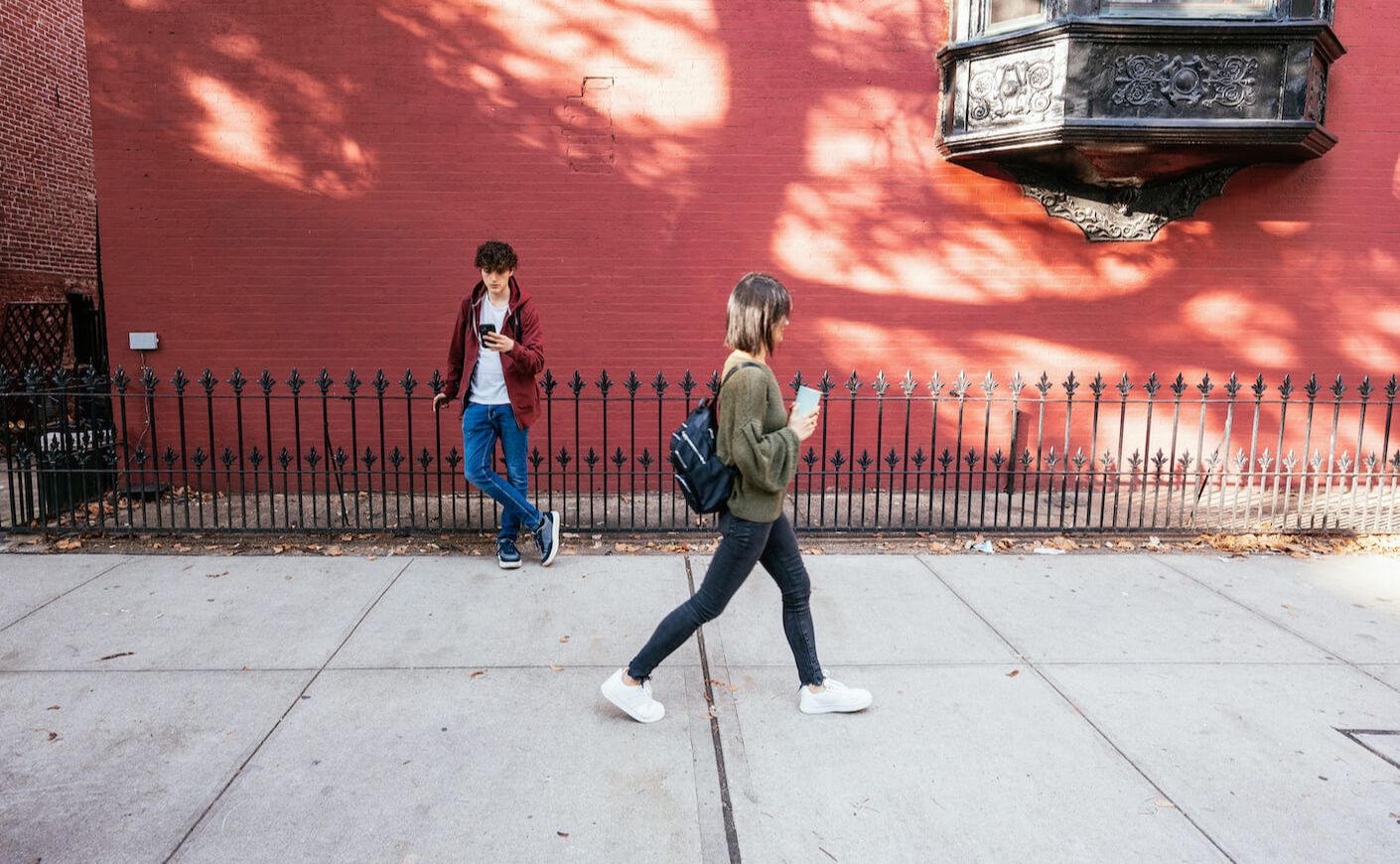 Two people ignoring each other in public.