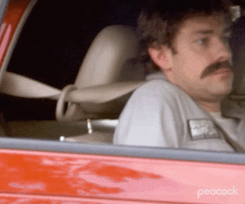Gif of Jim Halpert in the office reclining his car seat all the way back