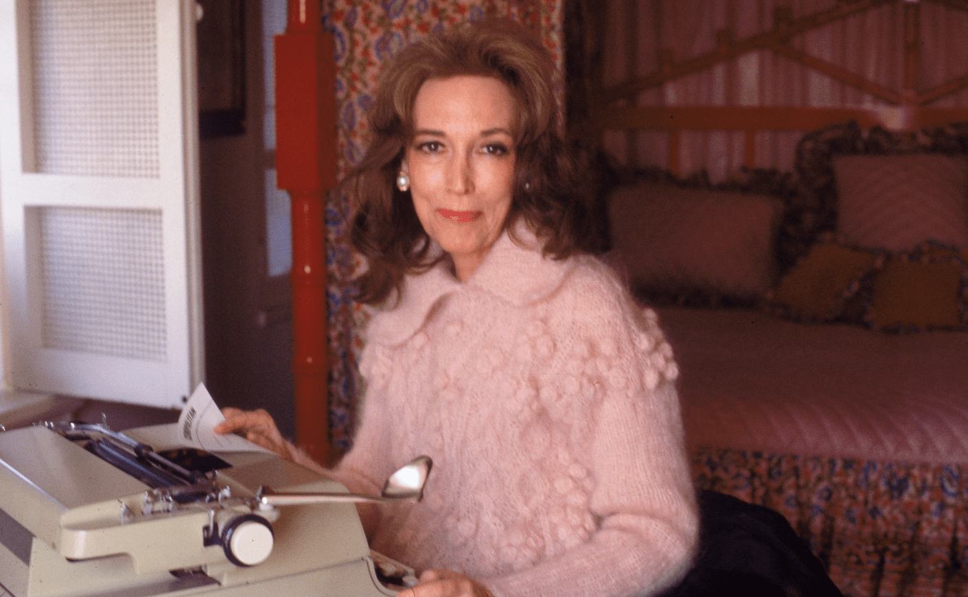 Helen Gurley Brown at typewriter