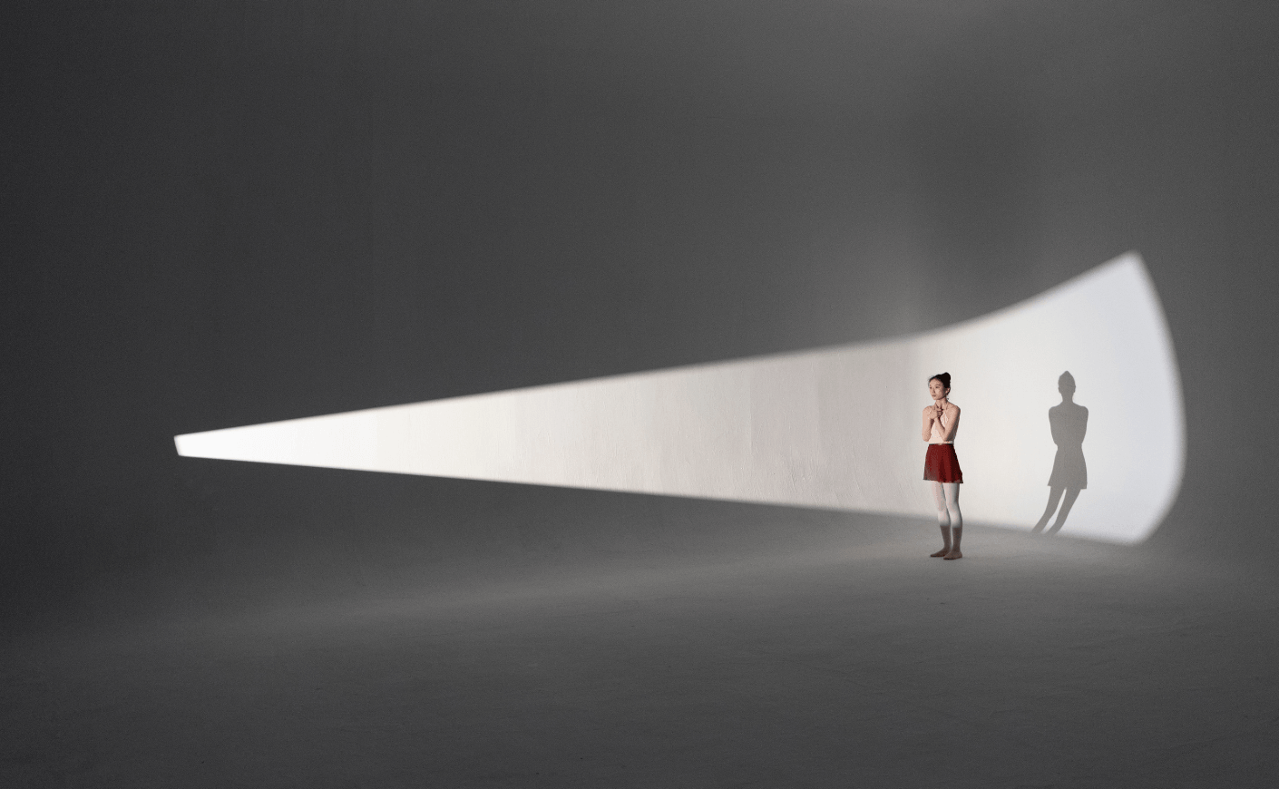 woman standing in spotlight