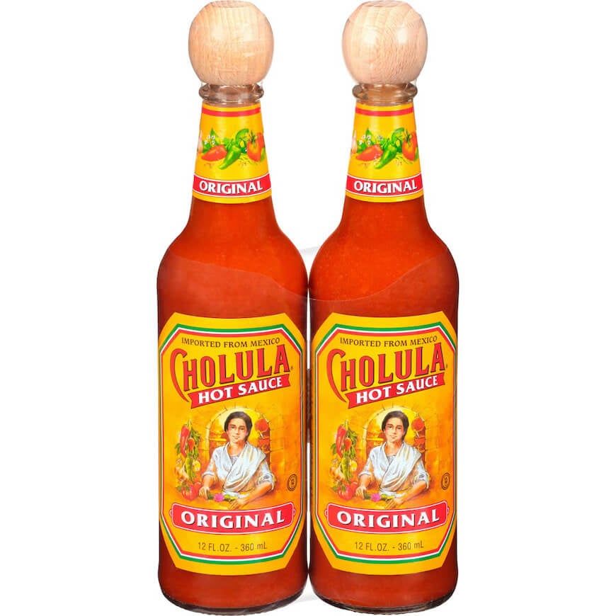 Two bottles of Cholula hot sauce.