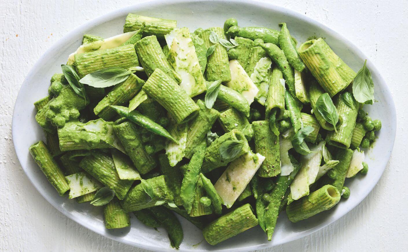 A plate of green pasta salad.