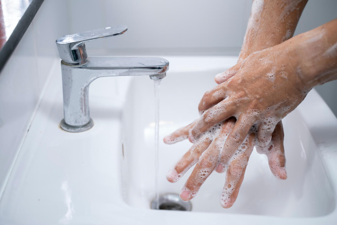 A person washing their hands