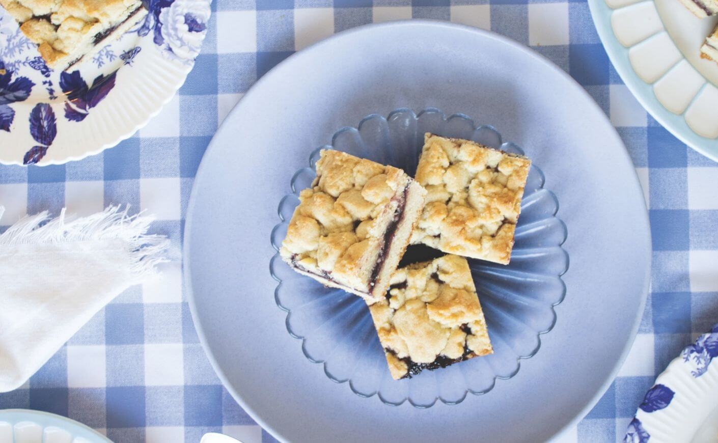 Jammy blackberry bars on a plate.