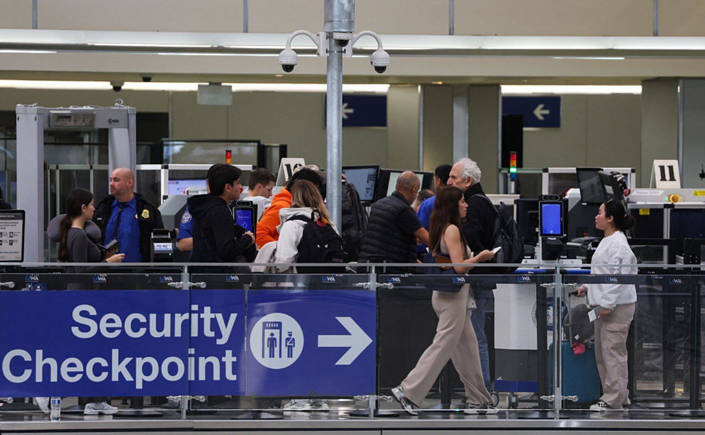 A "security checkpoint" sign at an airport