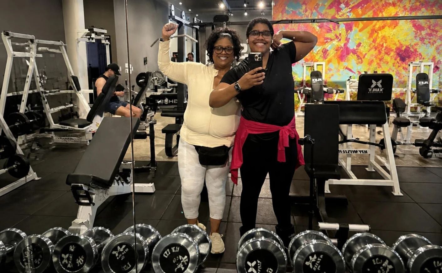 LaShae and Auby Rolle flex their muscles in the gym
