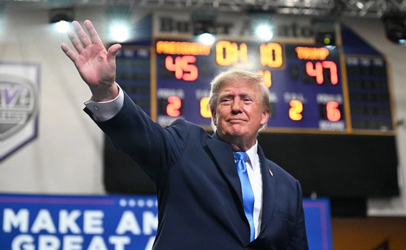 President Trump waves to a crowd.