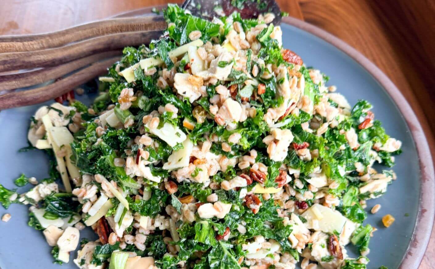 A fall harvest salad on a plate.